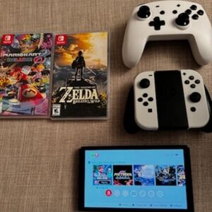 Nintendo Switch Oled Bundle with Zelda and Super Mario Cart